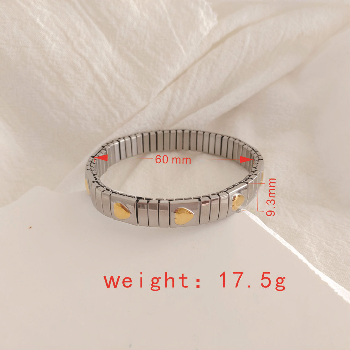 Two-toned 18k gold plated titanium elastic stretch bracelet adorned with heart pattern